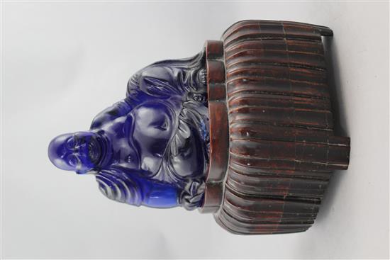 A Chinese Beijing blue glass seated figure of Budai, late 19th / early 20th century, total height 27cm, chip to Budais robes